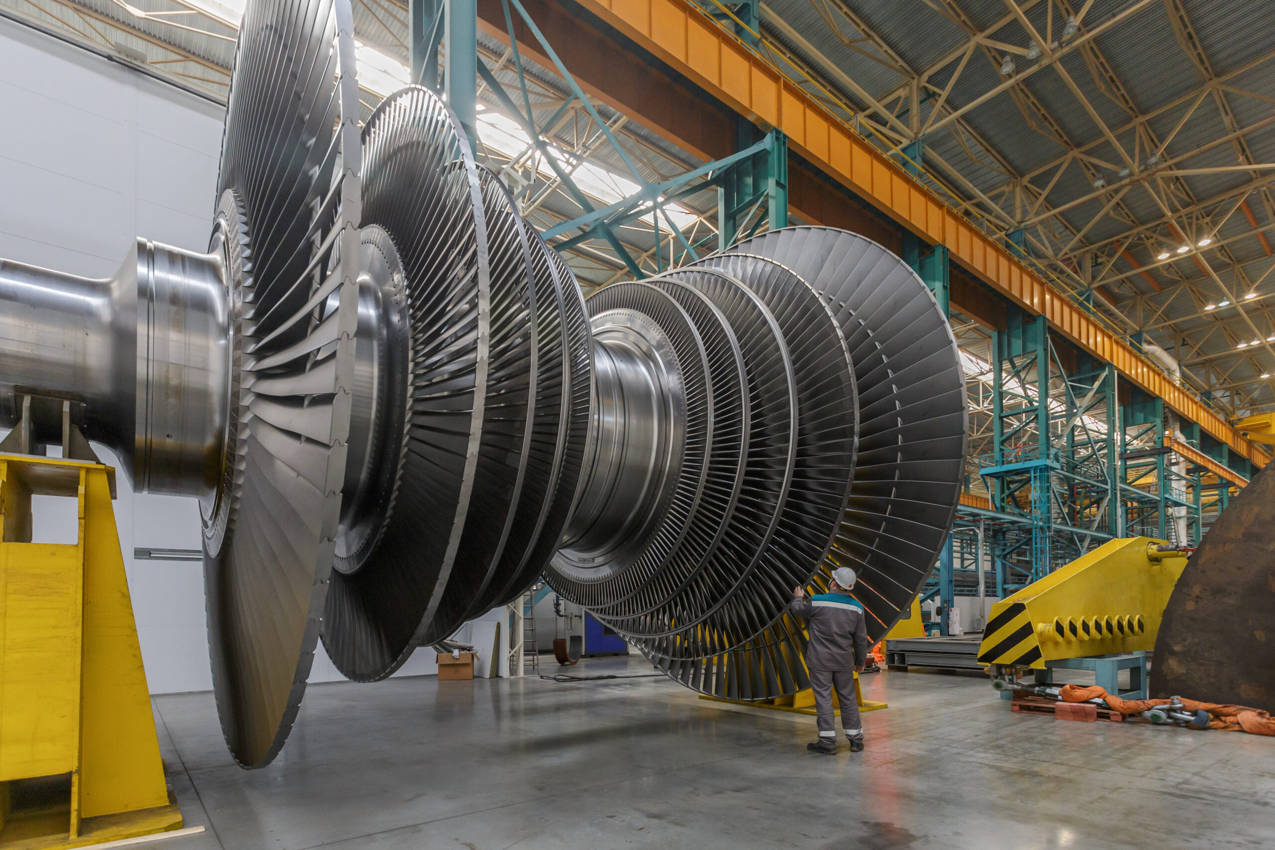 Assembly of a steam turbine rotor in a plant workshop. Power equipment manufacture with processing line.